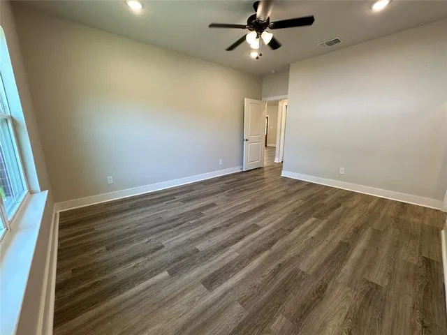 a bathroom with a glass door shower a sink and a mirror