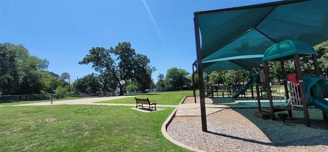 a view of park with bench and trees