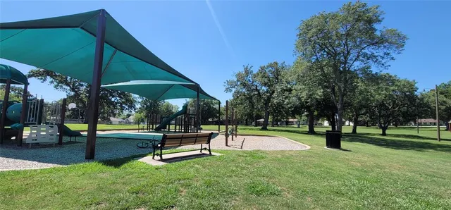 a view of outdoor space with pool and sitting area