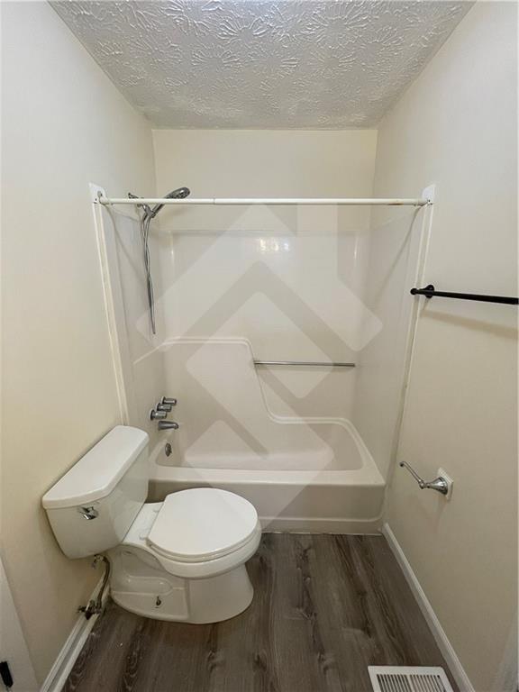 4267 Grogan Street Acworth, GA 30101 - Photo 25 of 37 a bathroom with a toilet and a shower