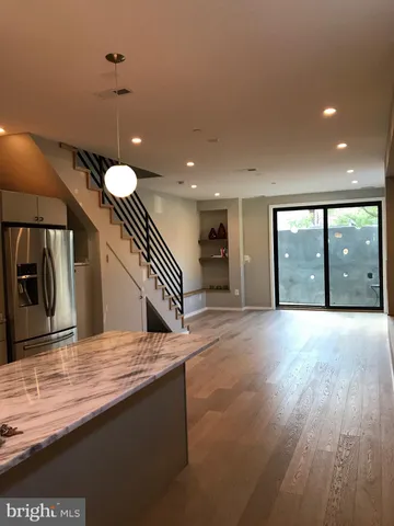 a view of a kitchen with a sink and a window