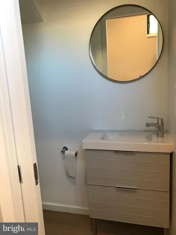 a bathroom with a sink and mirror