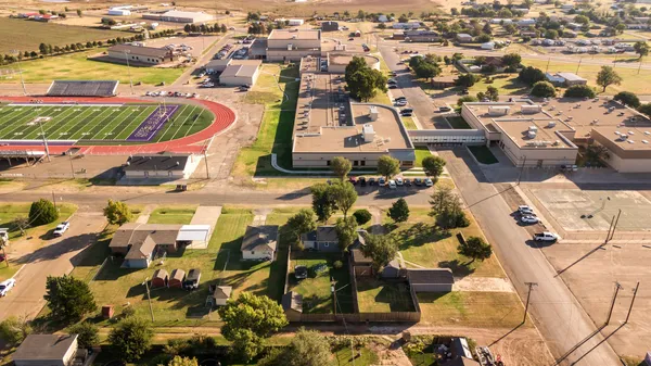 an aerial view of residential houses with outdoor space