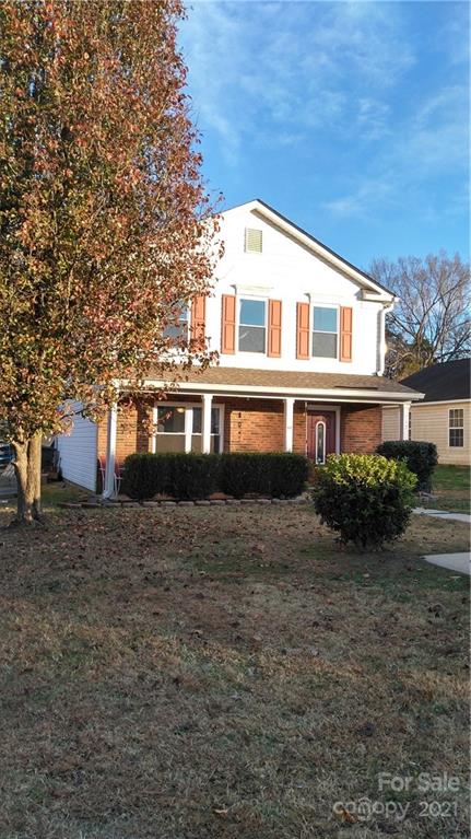3097 Rockingham Lane Southwest Concord, NC 28025 - Photo 1 of 1 a front view of a house with a yard