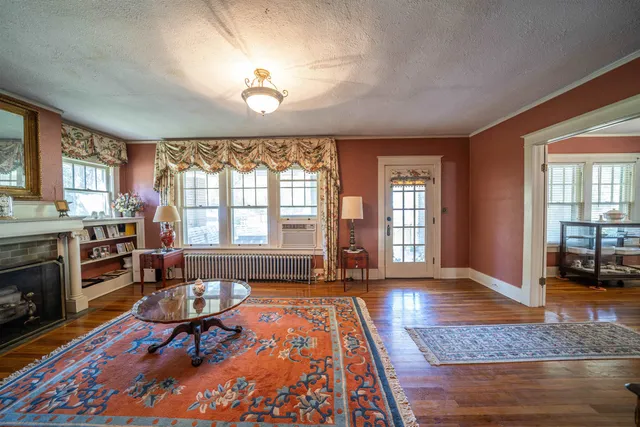 a living room with furniture and a fireplace