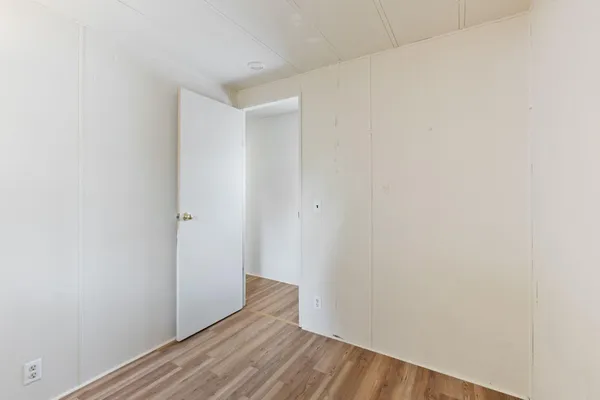 a view of small space with wooden floor