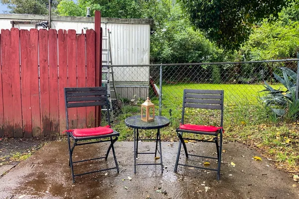 a patio with water table and chairs