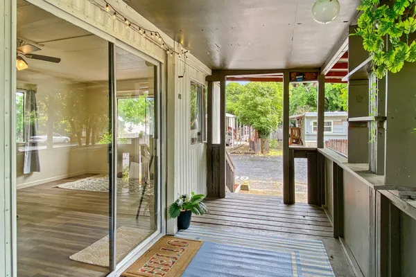 a view of a balcony with wooden floor