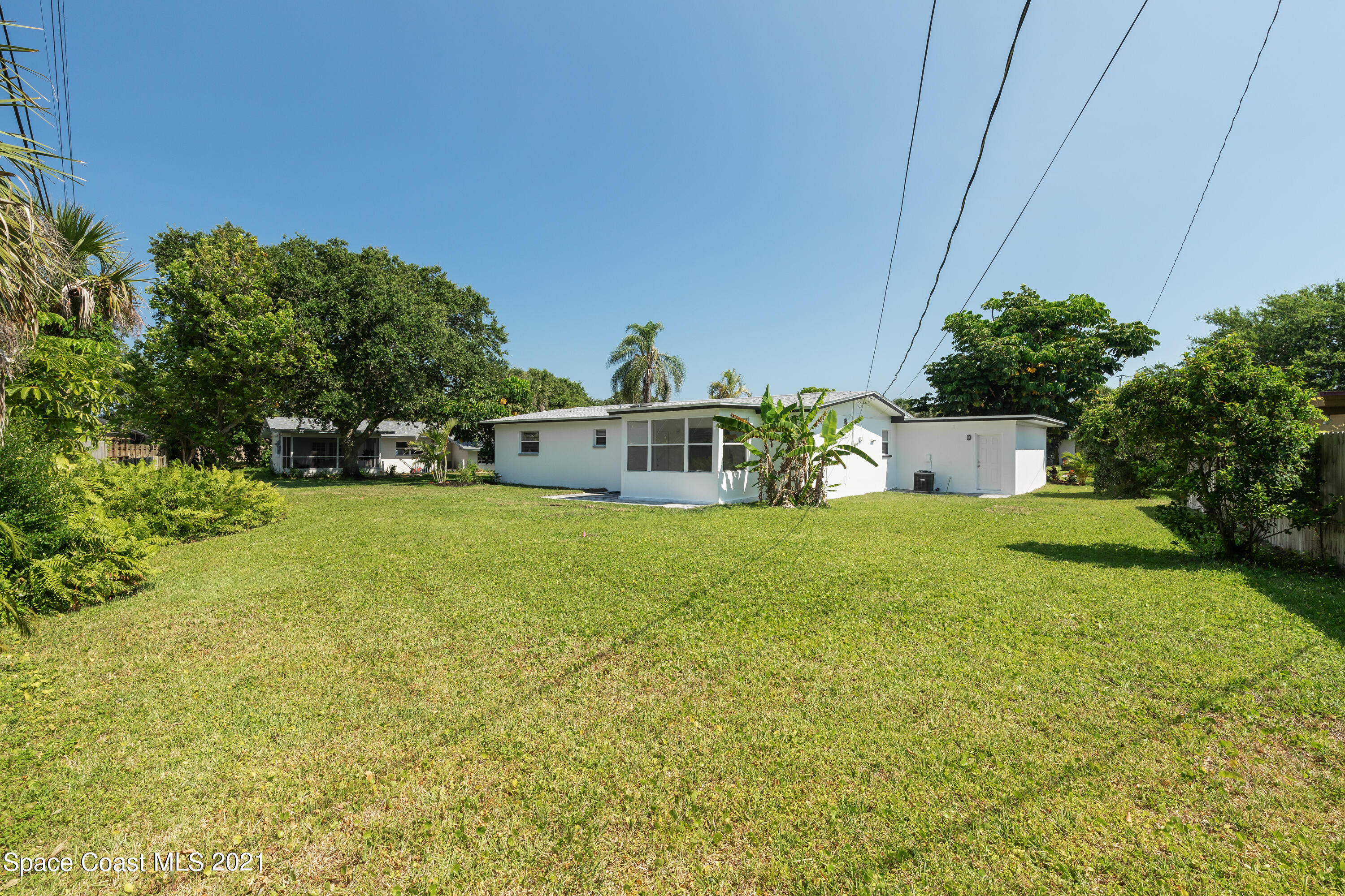 640 Java Road Cocoa Beach, FL 32931 - Photo 14 of 18 a house view with a garden space