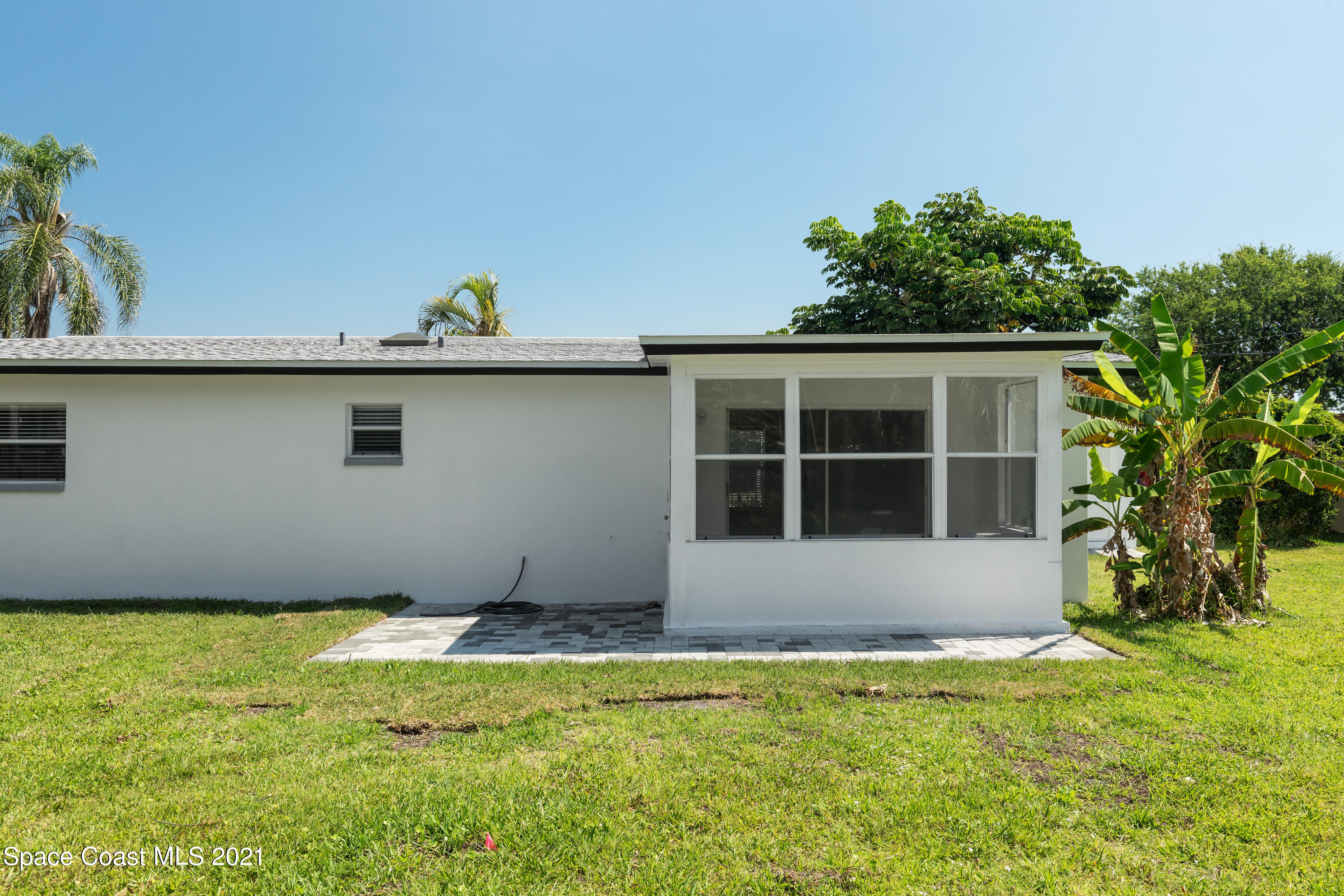640 Java Road Cocoa Beach, FL 32931 - Photo 15 of 18 a front view of a house with a yard