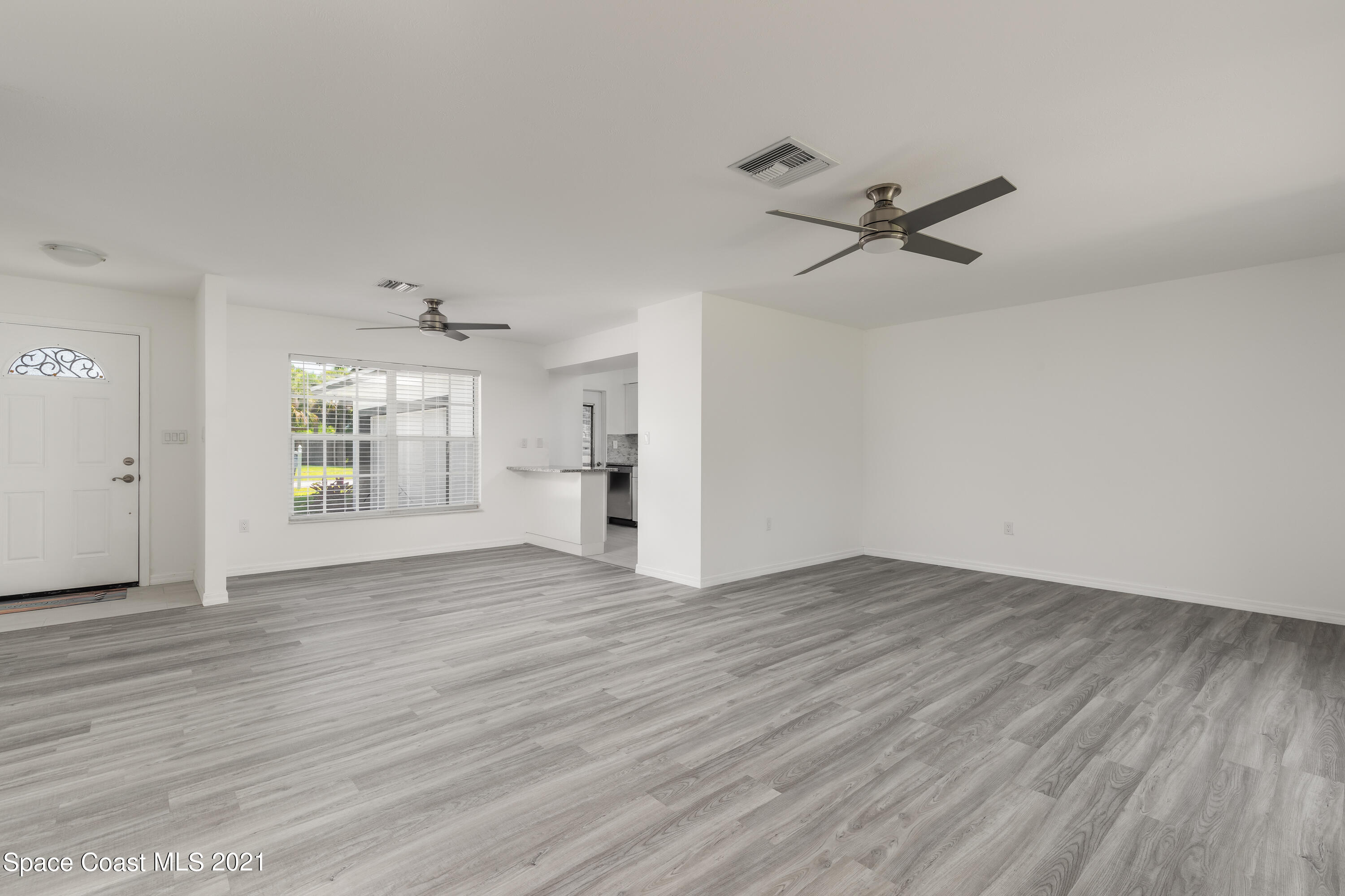 640 Java Road Cocoa Beach, FL 32931 - Photo 18 of 18 wooden floor in an empty room with a window