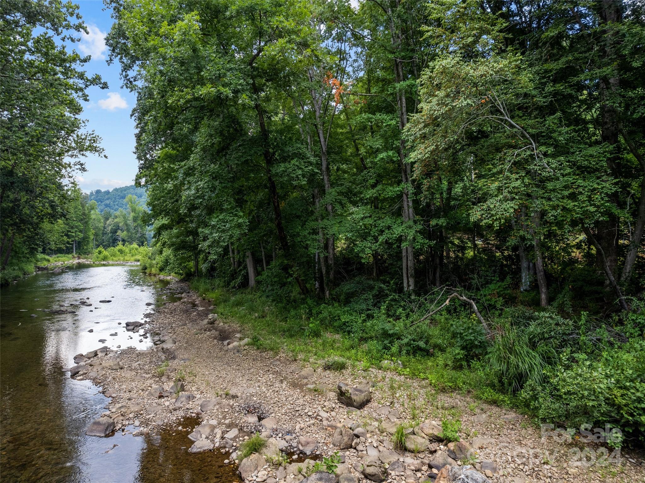 Tbd Cruso Road Canton, NC 28716 - Photo 16 of 17 a view of a lake with lots of green space and trees
