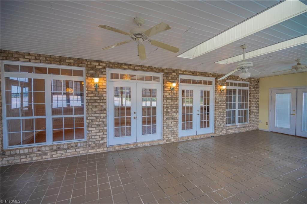2307 Riverside Drive Lexington, NC 27292 - Photo 14 of 30 Sunroom off great room, tile flooring, access to brick enclosed deck