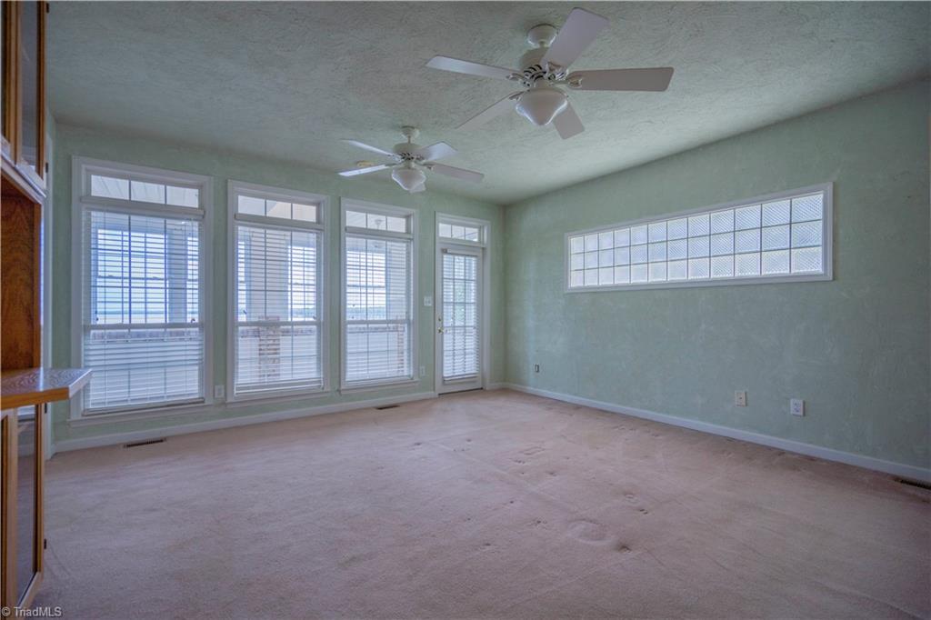 2307 Riverside Drive Lexington, NC 27292 - Photo 19 of 30 Primary bedroom with access to private sunroom lakeside