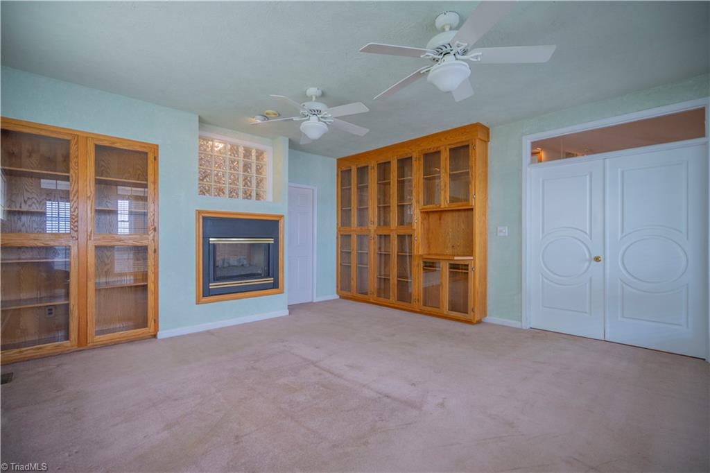 2307 Riverside Drive Lexington, NC 27292 - Photo 20 of 30 Built-ins primary bedroom together with see-thru fireplace to bath