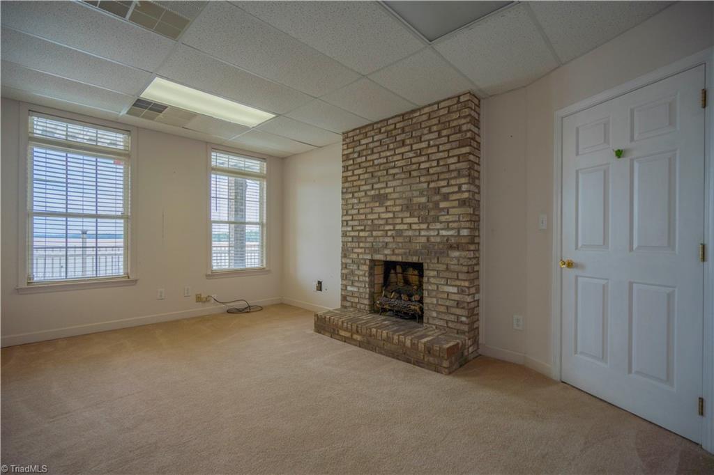2307 Riverside Drive Lexington, NC 27292 - Photo 27 of 30 Lower level office with fireplace