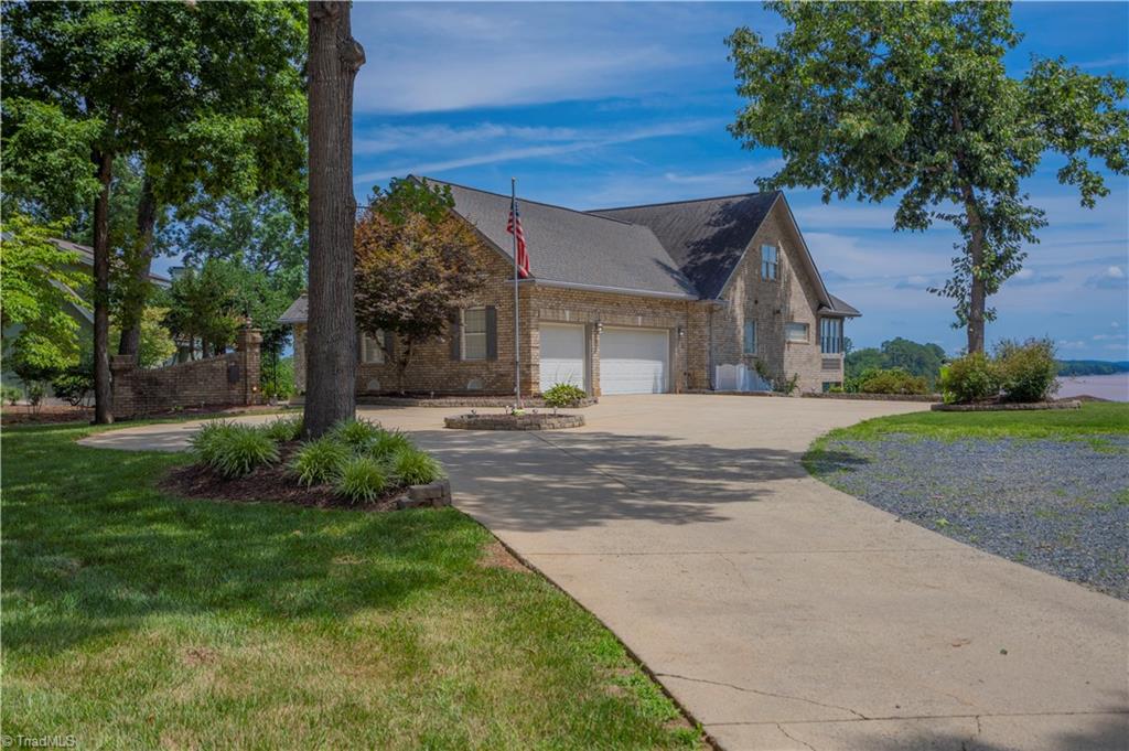 Paved, circle drive  to home with 3-car garage