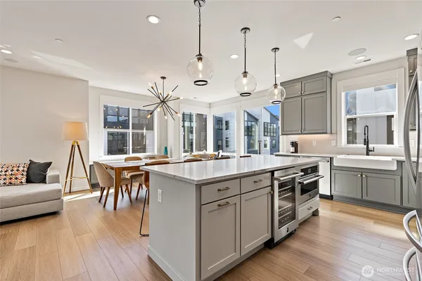 a large kitchen with a table and chairs