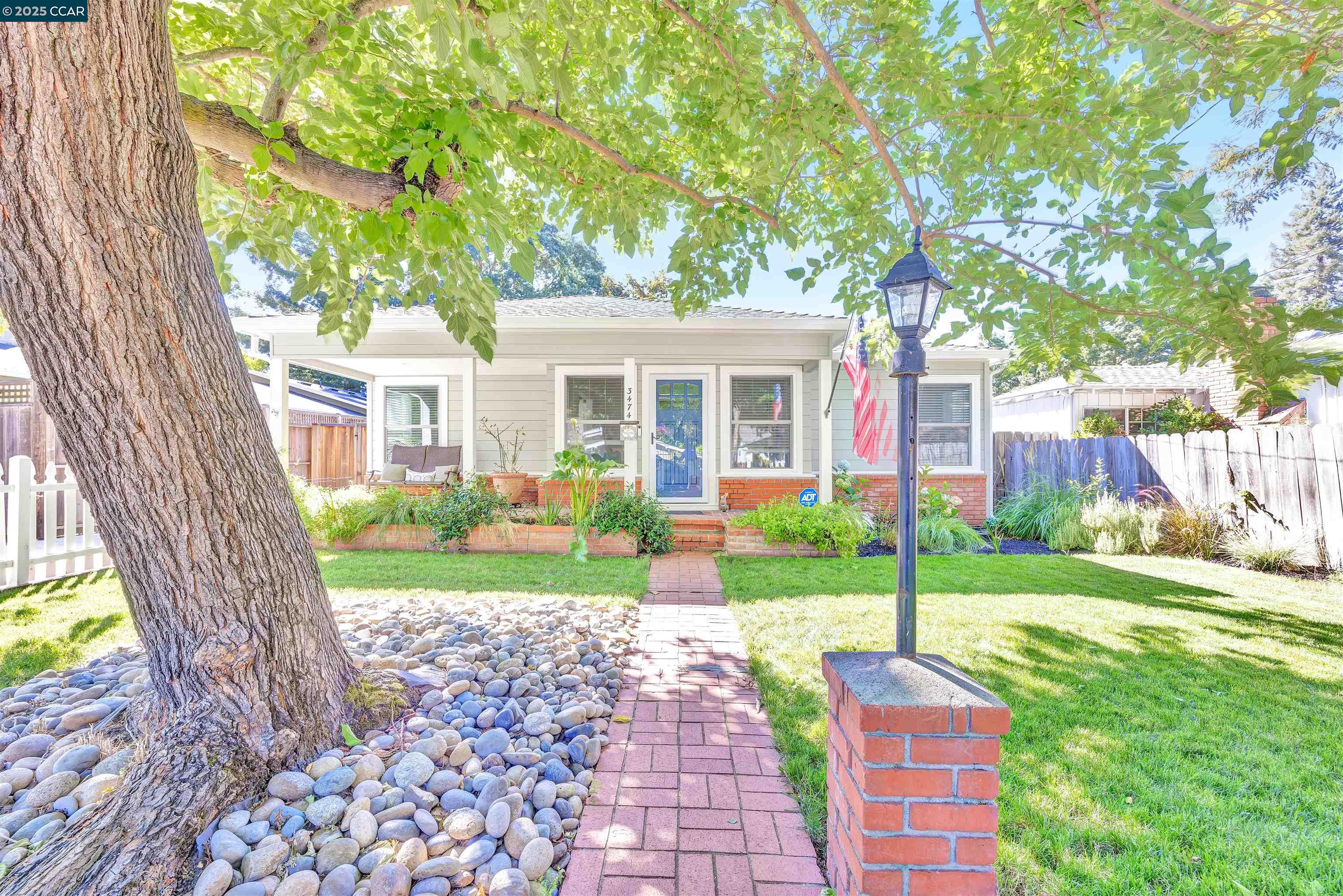 3474 Monroe Avenue Lafayette, CA 94549 - Photo 1 of 1 a front view of a house with garden