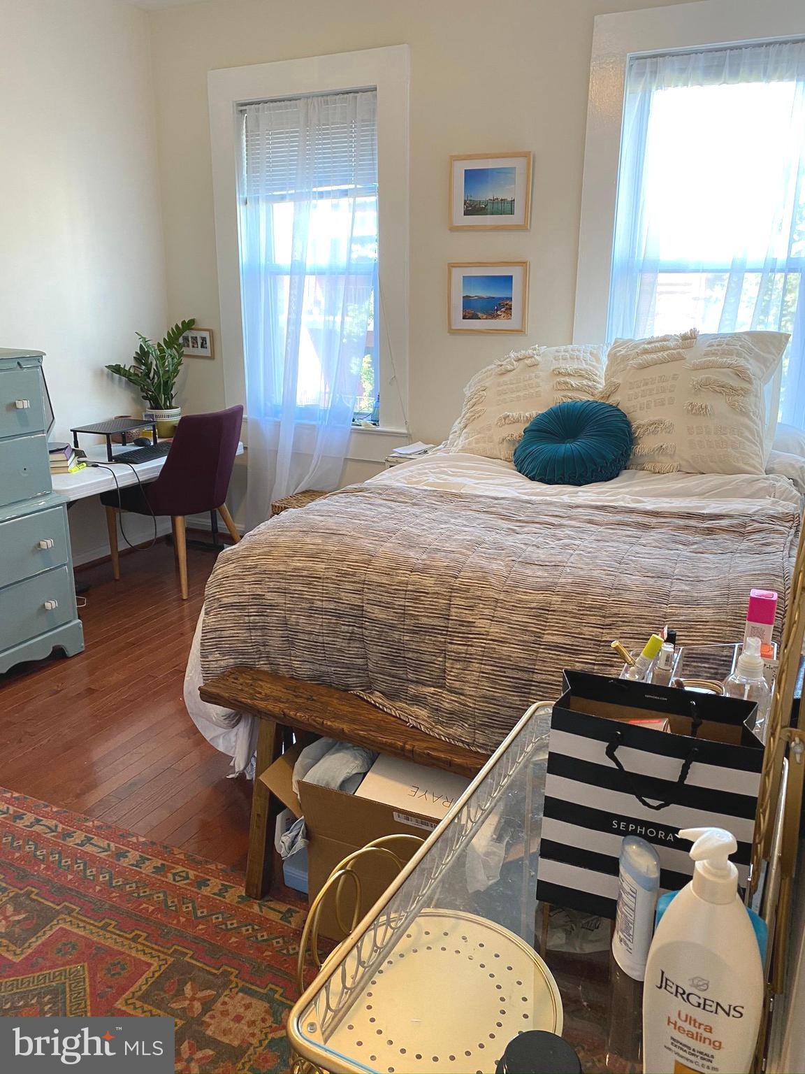 1456 Corcoran Street Northwest, Unit 3 Washington, DC 20009 - Photo 12 of 26 a bedroom with a bed and window