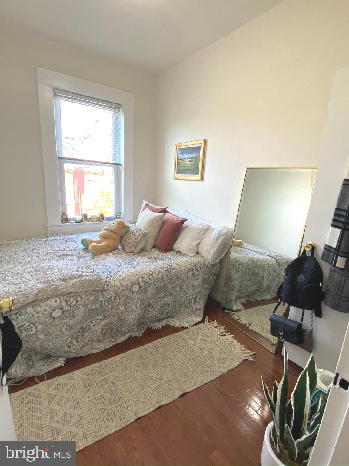 1456 Corcoran Street Northwest, Unit 3 Washington, DC 20009 - Photo 15 of 26 a bedroom with a bed and window