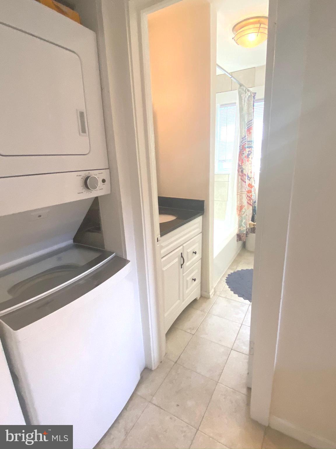 1456 Corcoran Street Northwest, Unit 3 Washington, DC 20009 - Photo 18 of 26 a bathroom with a sink a mirror and a bath tub