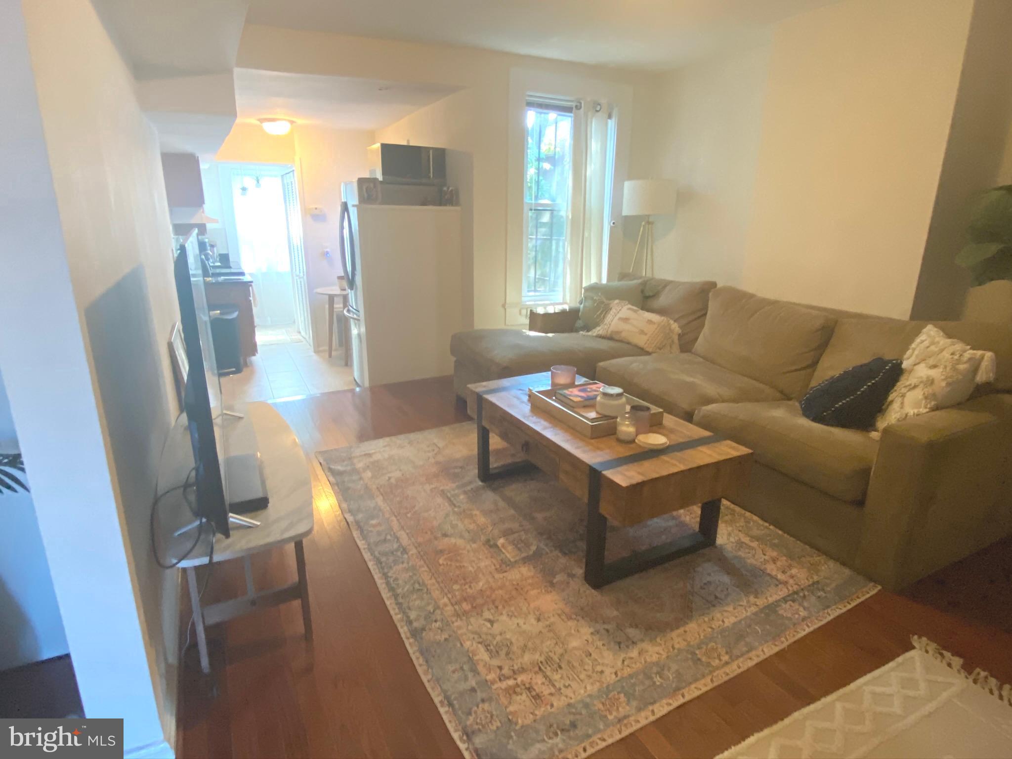 1456 Corcoran Street Northwest, Unit 3 Washington, DC 20009 - Photo 3 of 26 a living room with furniture and a large window