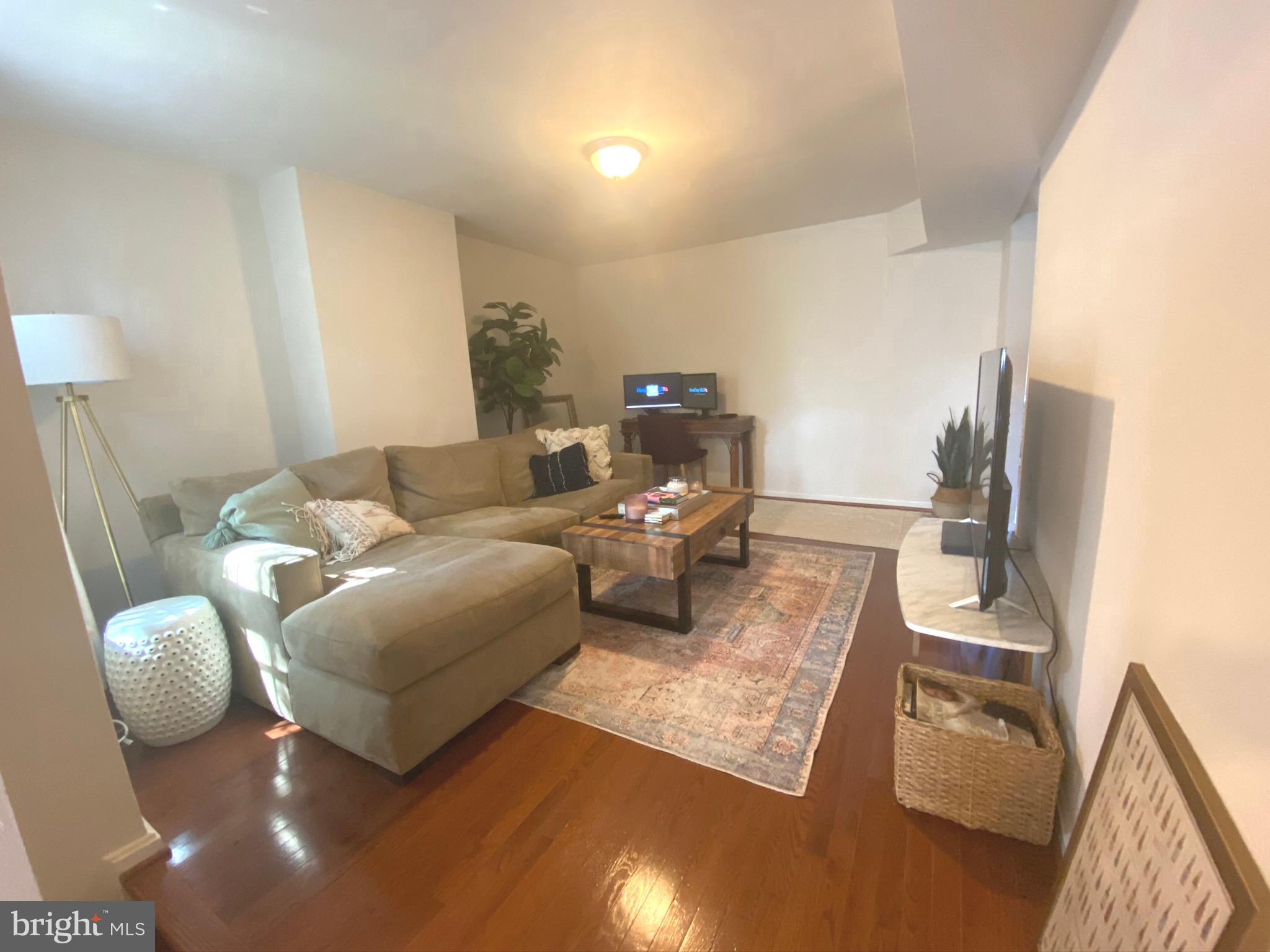 1456 Corcoran Street Northwest, Unit 3 Washington, DC 20009 - Photo 4 of 26 a living room with furniture and a couch