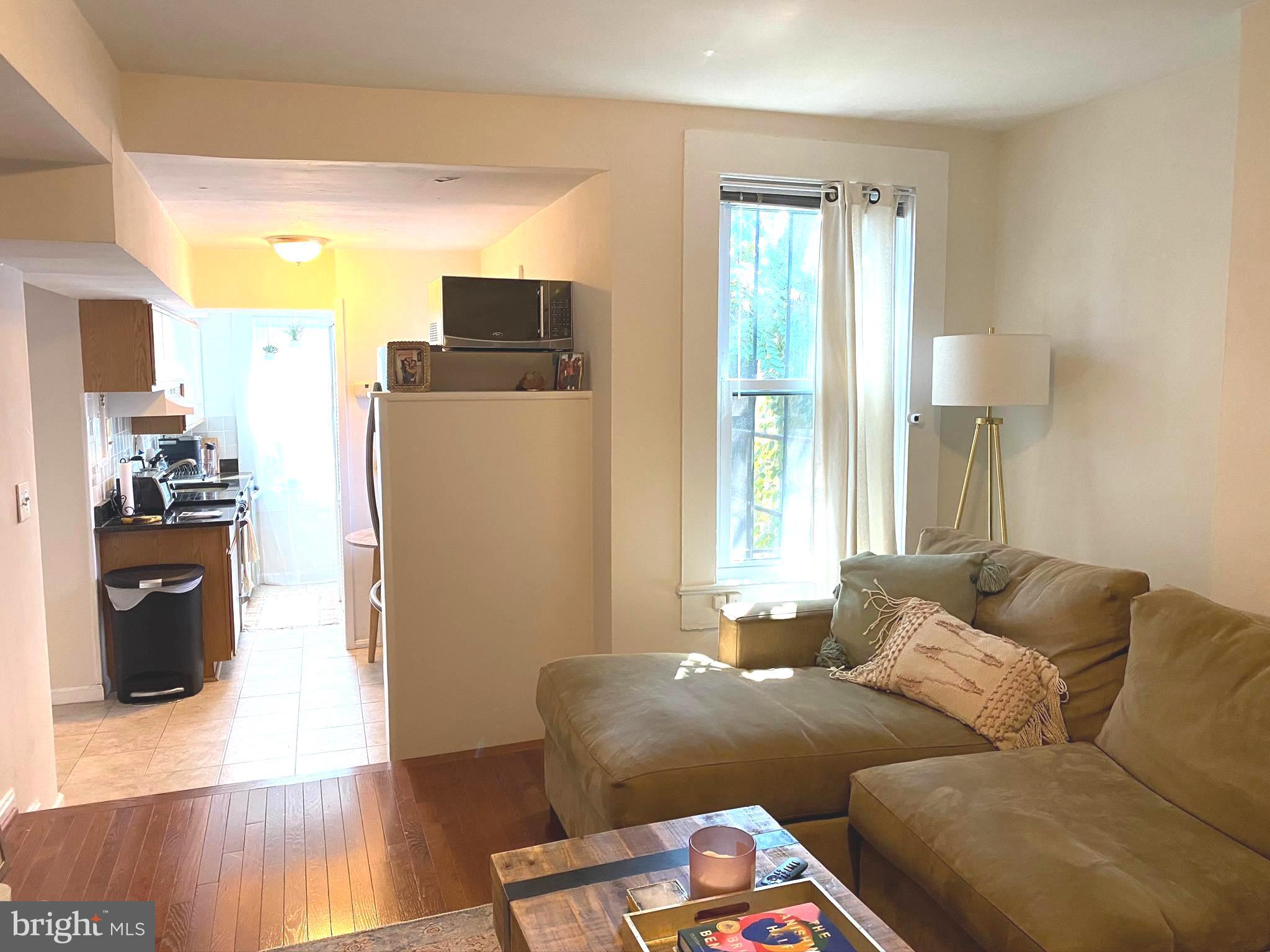 1456 Corcoran Street Northwest, Unit 3 Washington, DC 20009 - Photo 7 of 26 a living room with furniture and wooden floor
