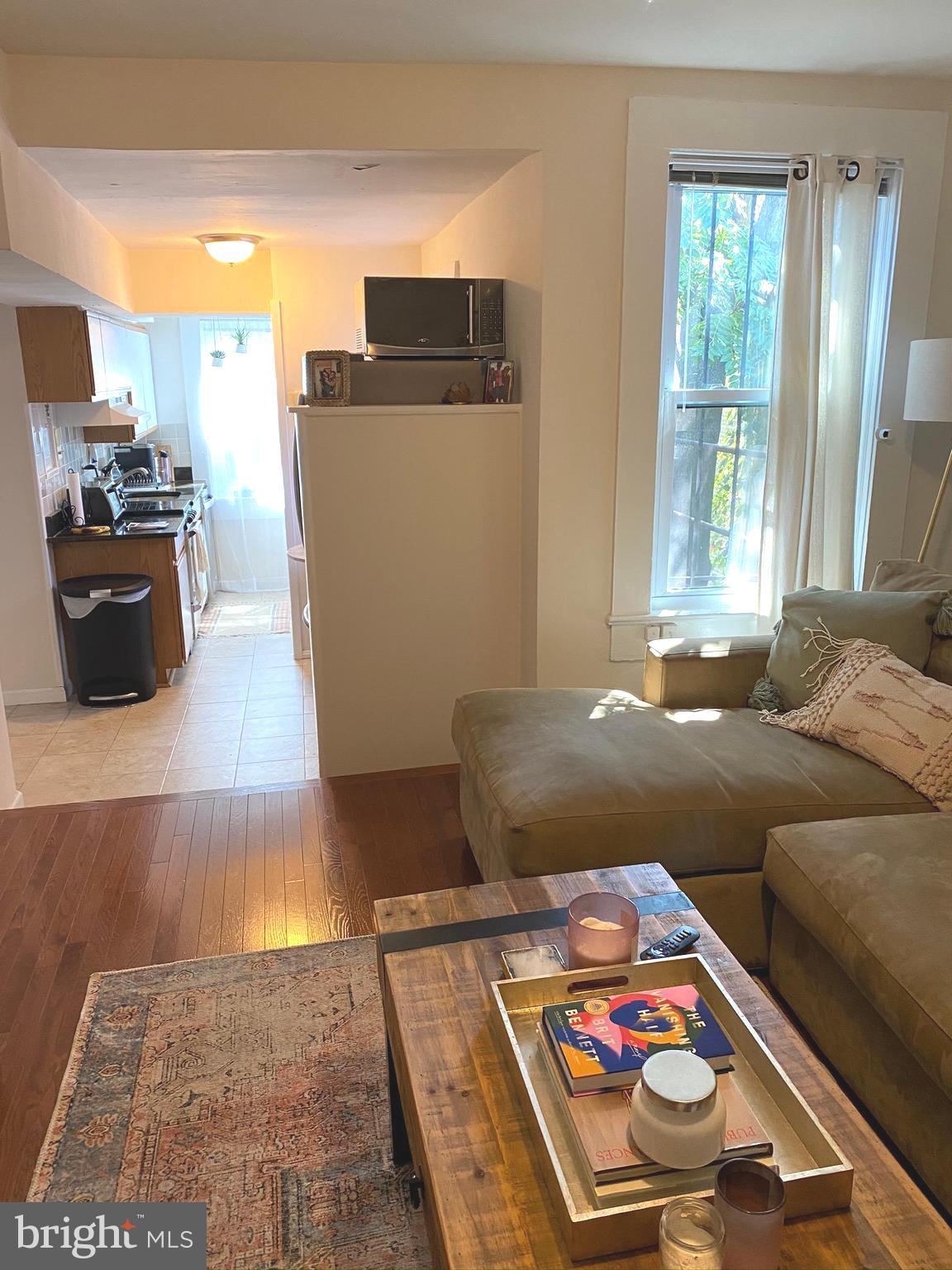 1456 Corcoran Street Northwest, Unit 3 Washington, DC 20009 - Photo 8 of 26 a bedroom with furniture and a window