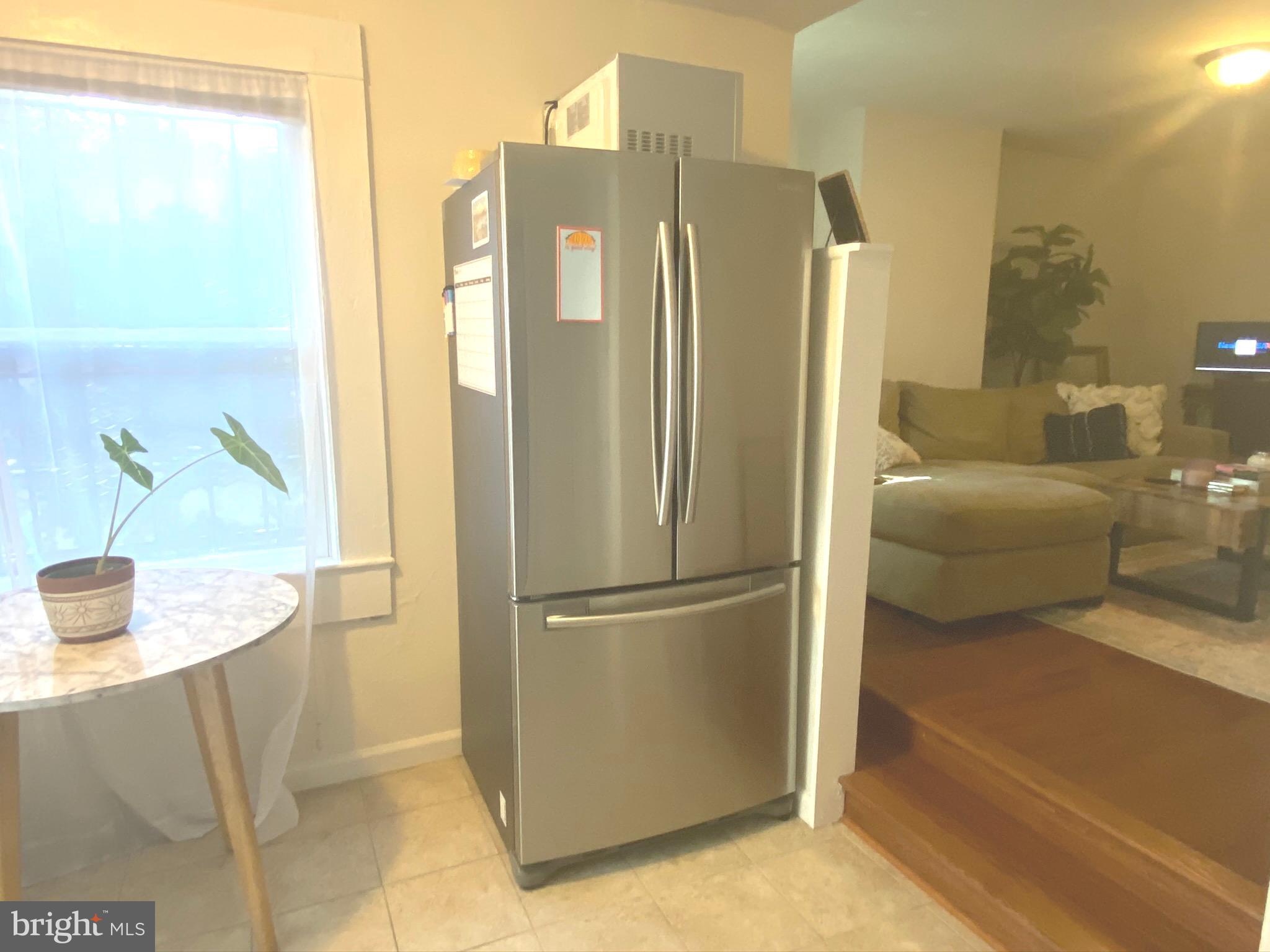 1456 Corcoran Street Northwest, Unit 3 Washington, DC 20009 - Photo 9 of 26 a kitchen with stainless steel appliances granite countertop a refrigerator and a sink