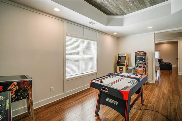 a view of a dining room with furniture window and wooden floor