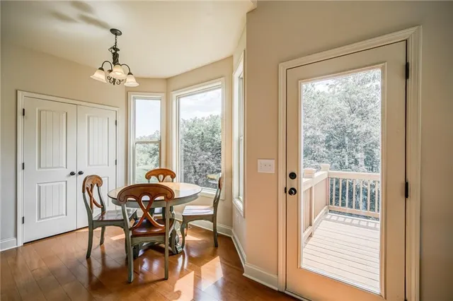 a spacious bathroom with a double vanity sink a mirror and a shower