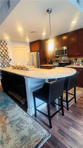 a view of swimming pool with outdoor seating