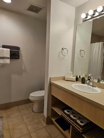 a living room with a bed and a window