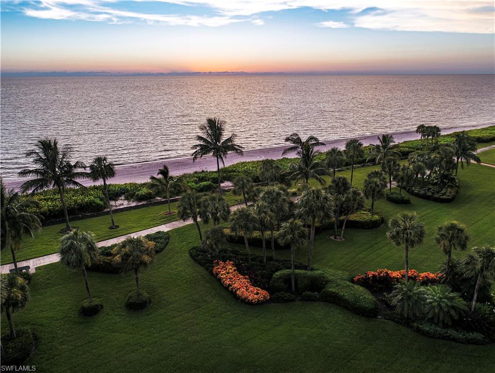 504 Turtle Hatch Road Naples, FL 34103 - Photo 5 of 5 a view of a lake with a yard and outdoor seating