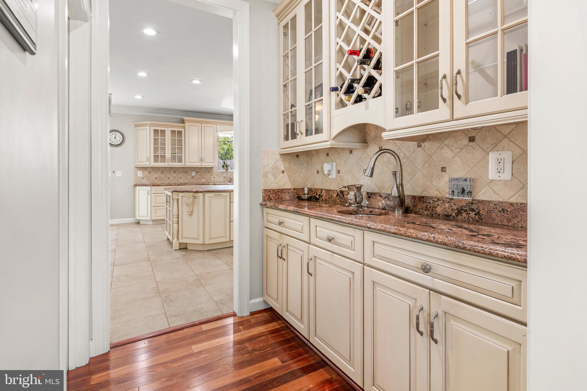 3213 Hatton Road Baltimore, MD 21208 - Photo 11 of 69 a kitchen with stainless steel appliances granite countertop a refrigerator and a sink