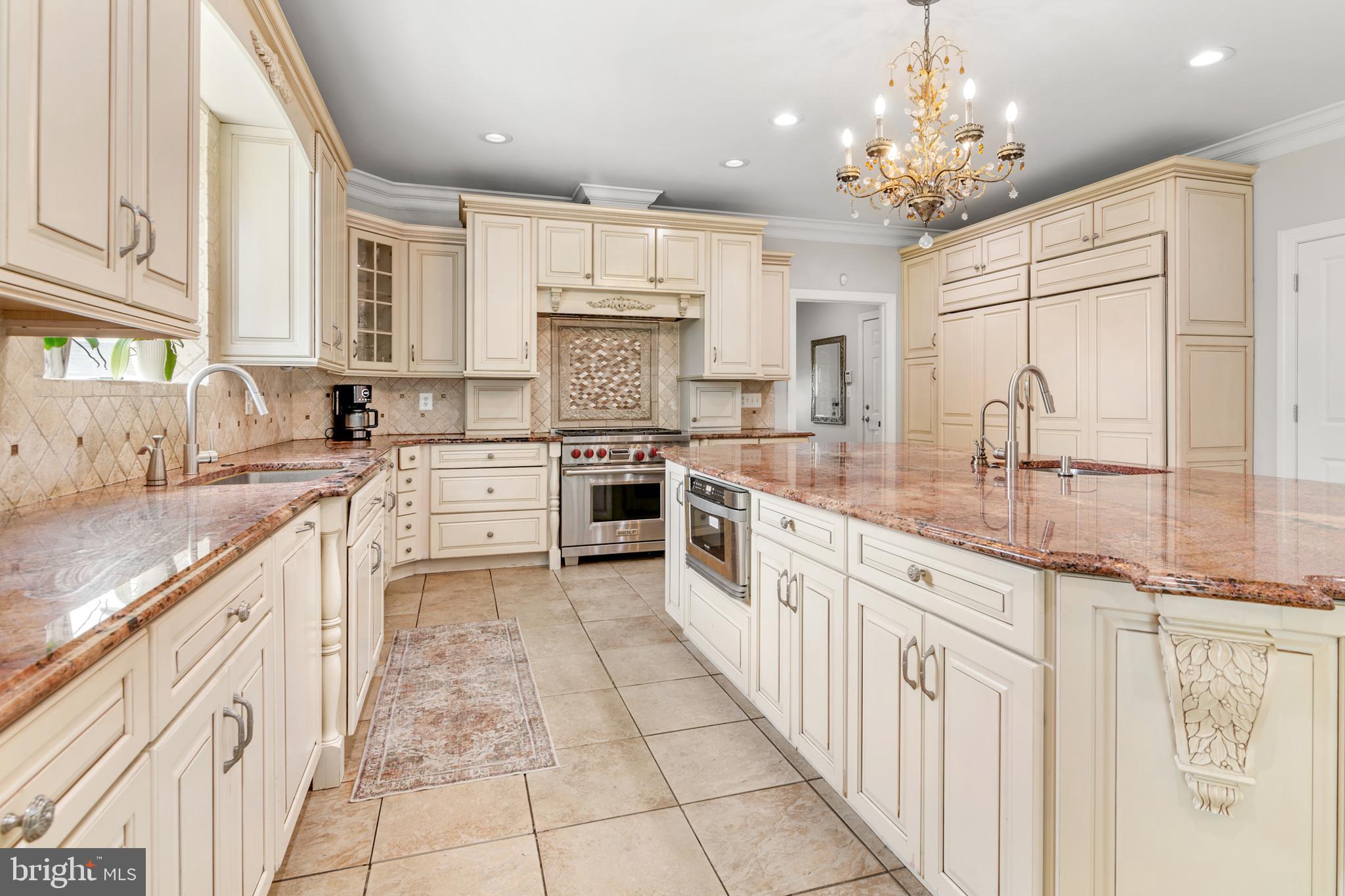 3213 Hatton Road Baltimore, MD 21208 - Photo 14 of 69 a large kitchen with stainless steel appliances lots of counter space sink and cabinets