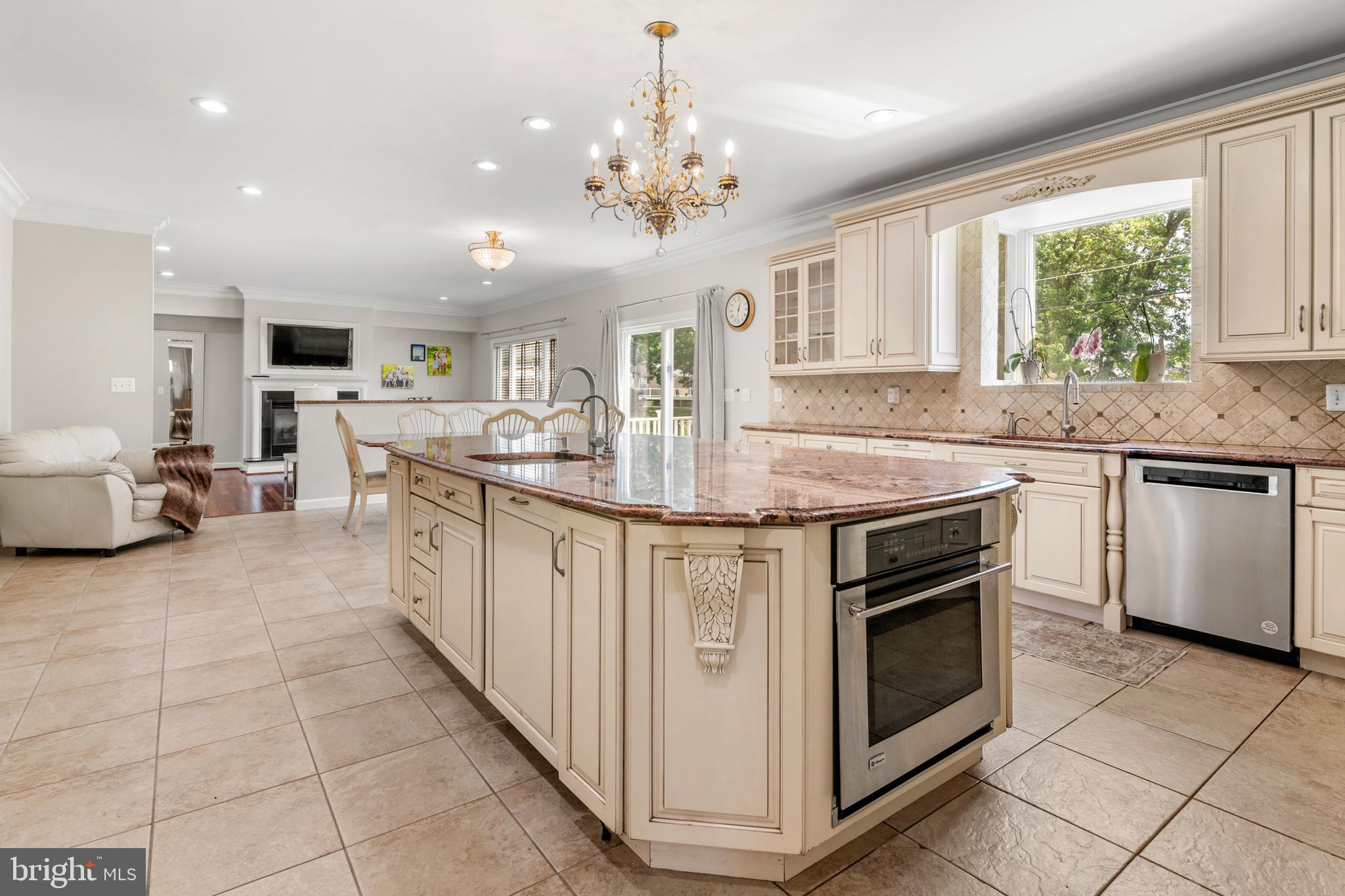 3213 Hatton Road Baltimore, MD 21208 - Photo 16 of 69 a kitchen with stainless steel appliances granite countertop a stove and cabinets