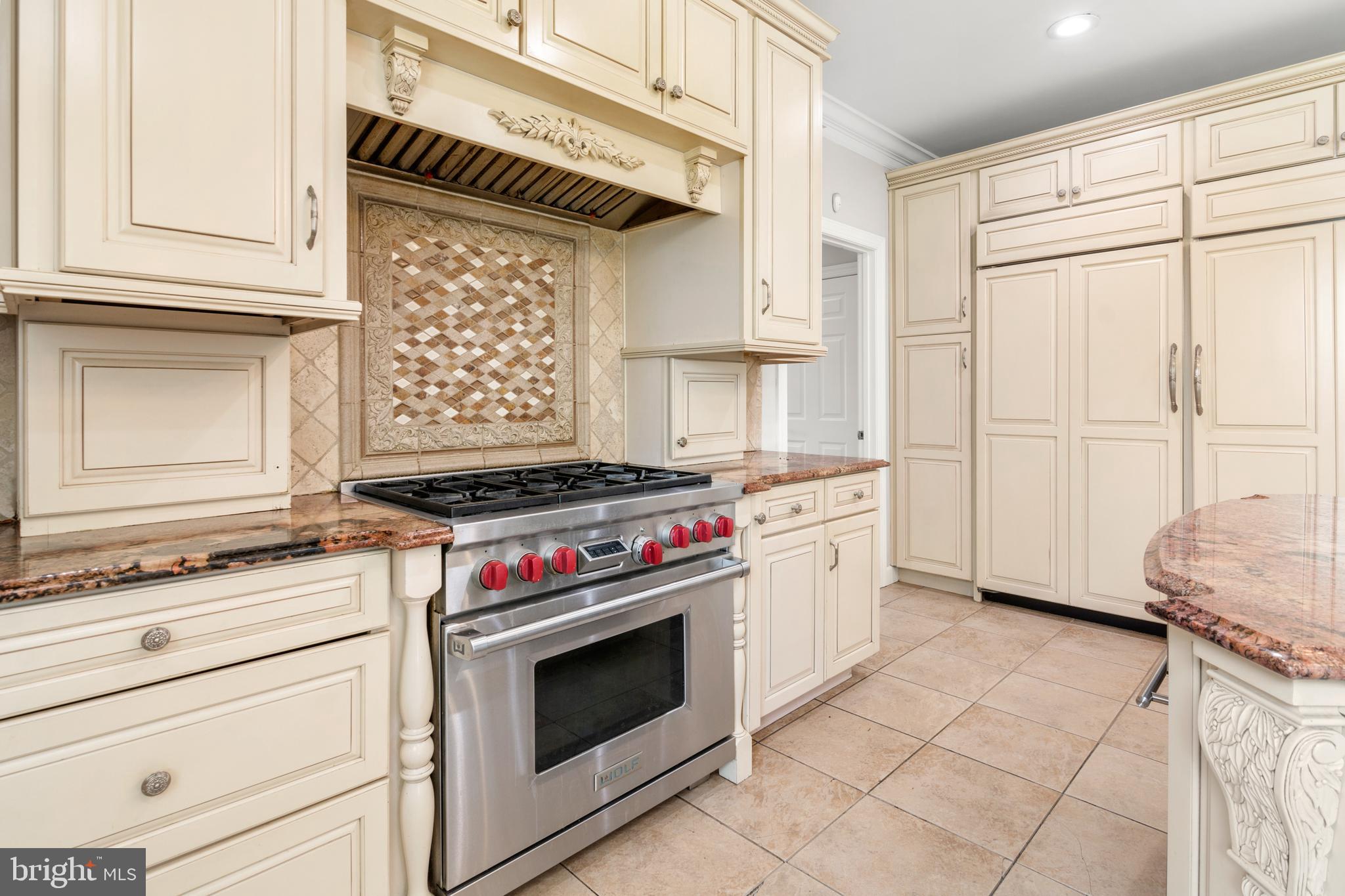 3213 Hatton Road Baltimore, MD 21208 - Photo 17 of 69 a kitchen with a stove and a cabinet