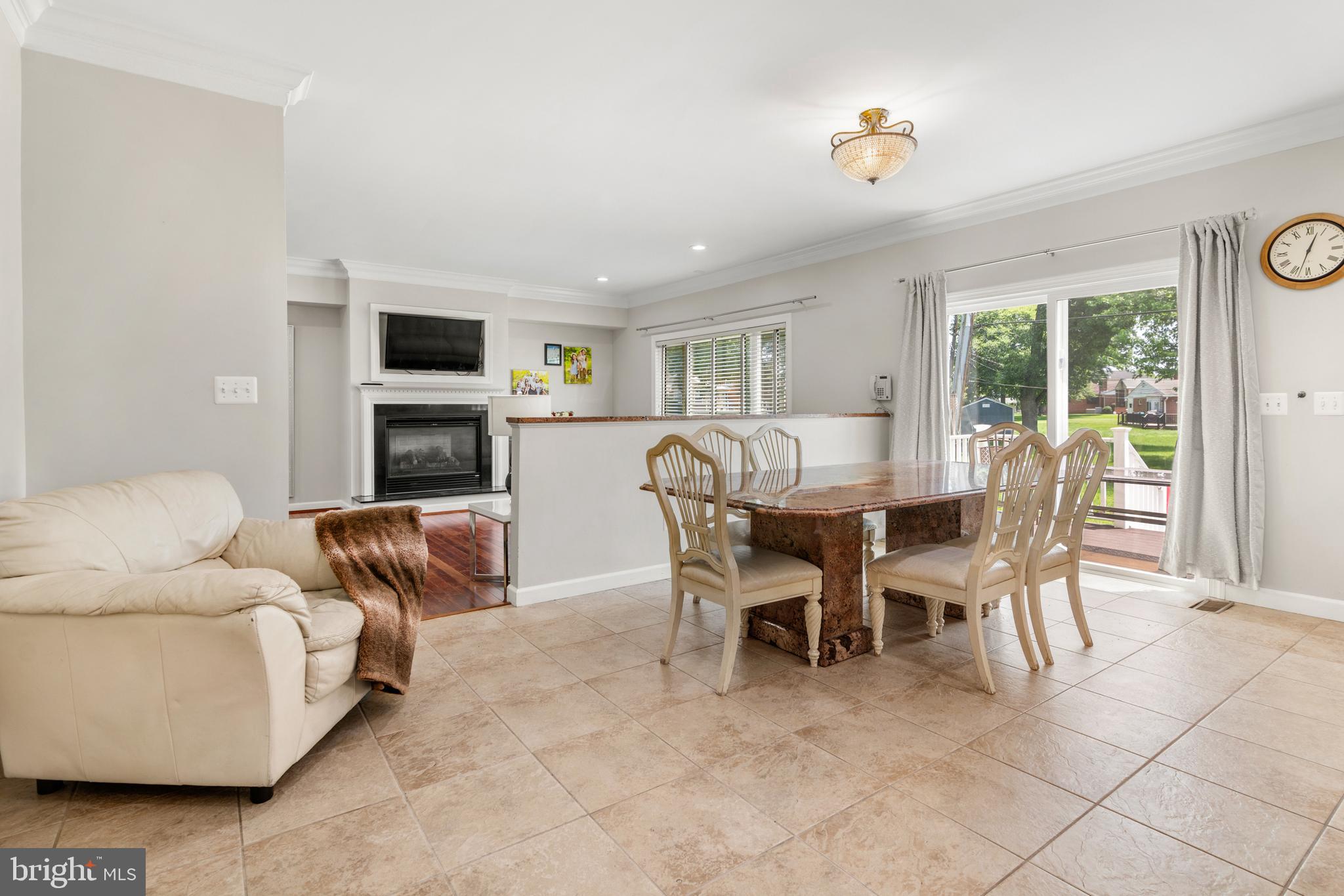 3213 Hatton Road Baltimore, MD 21208 - Photo 20 of 69 a living room with furniture and a fireplace