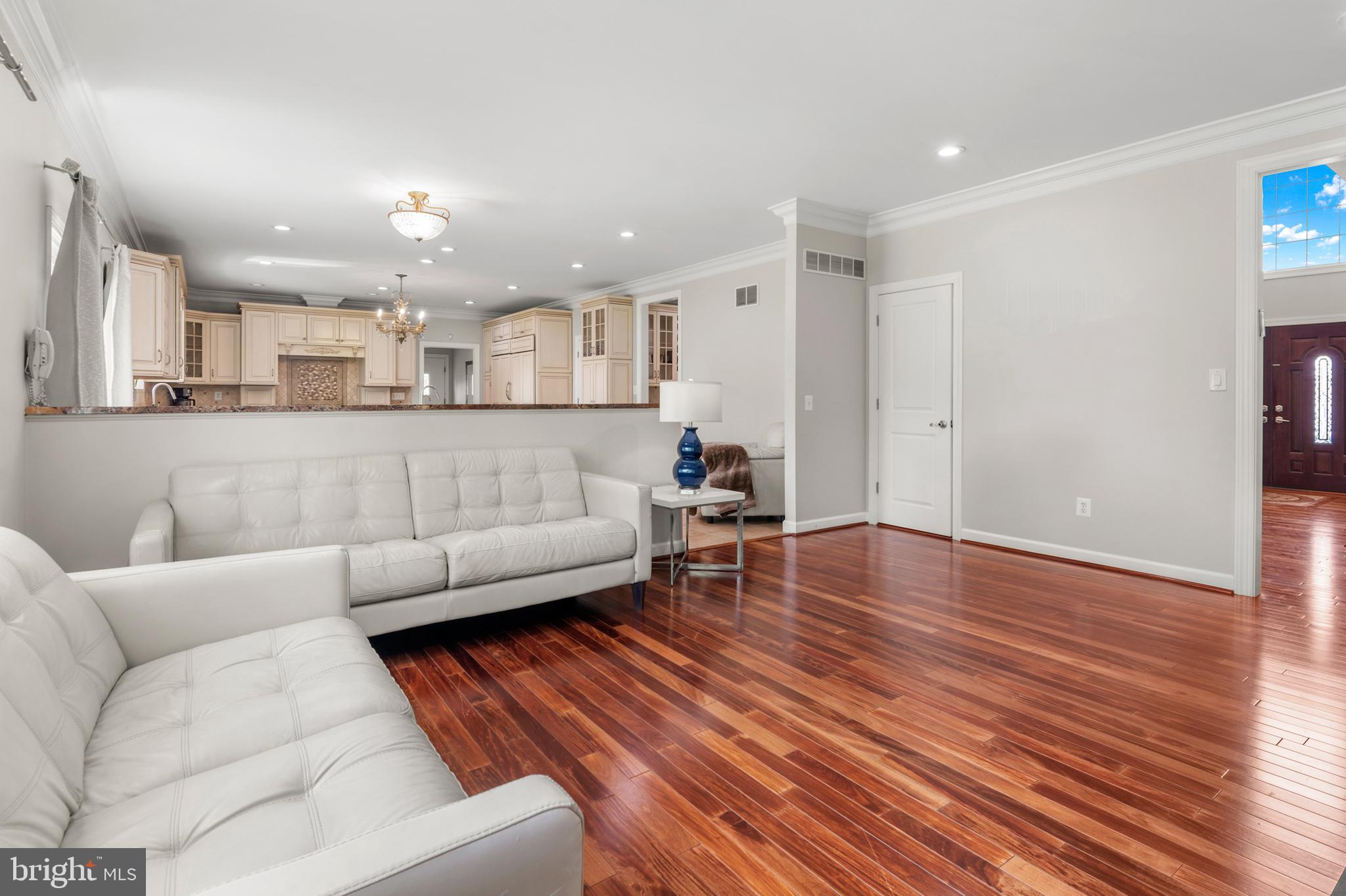 3213 Hatton Road Baltimore, MD 21208 - Photo 21 of 69 a living room with furniture and a wooden floor