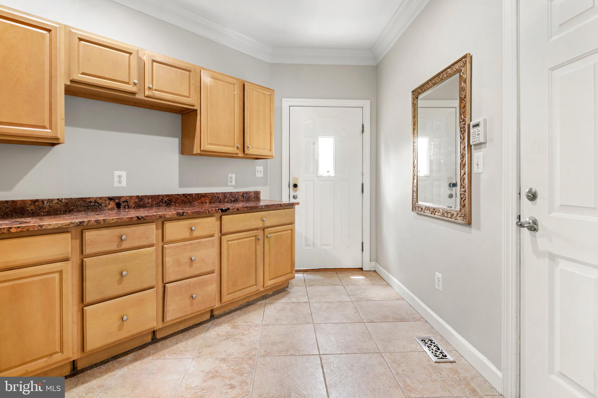 3213 Hatton Road Baltimore, MD 21208 - Photo 26 of 69 a spacious bathroom with a granite countertop sink a mirror and a