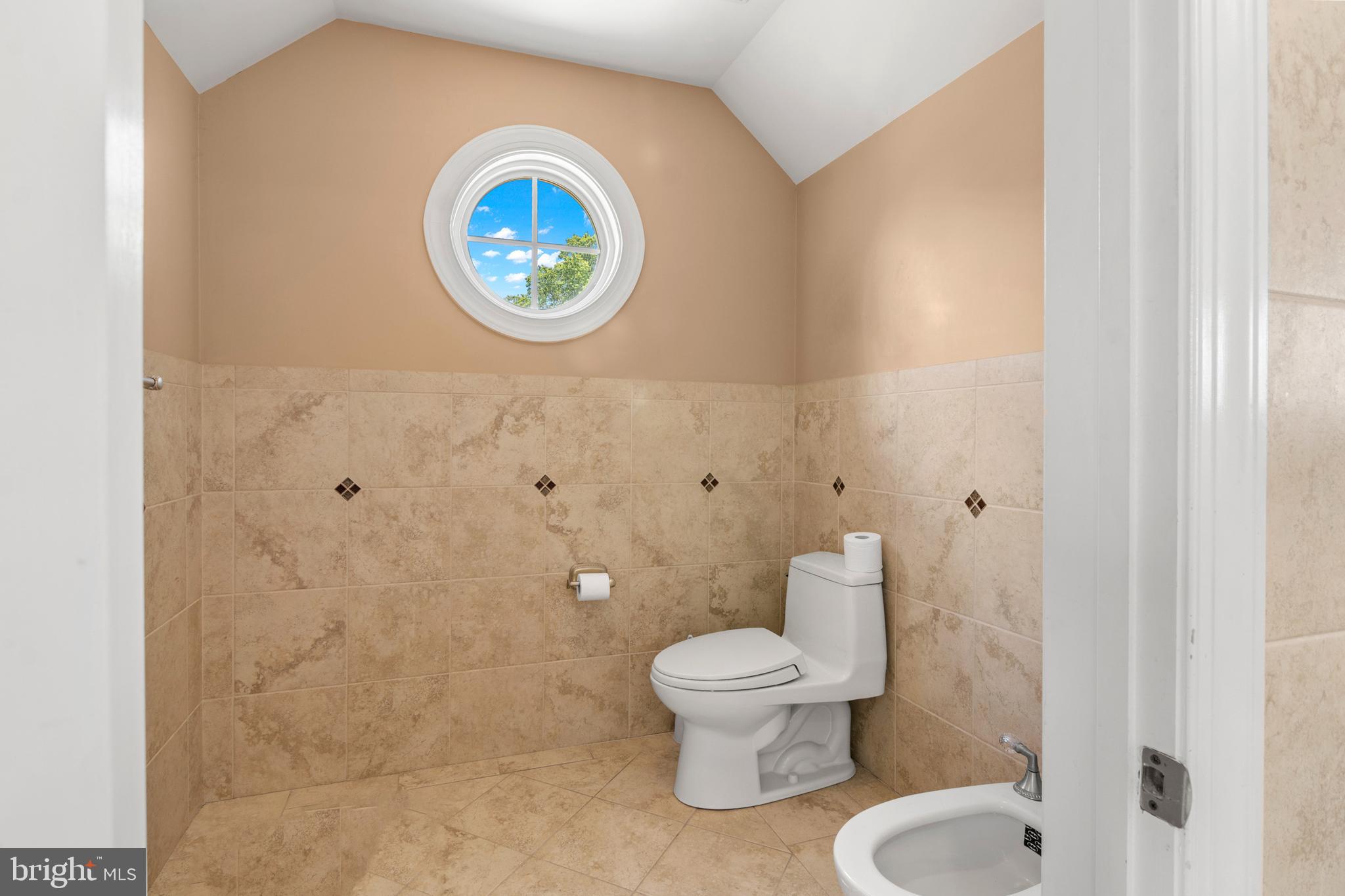 3213 Hatton Road Baltimore, MD 21208 - Photo 47 of 69 a white toilet sitting next to a bathroom sink