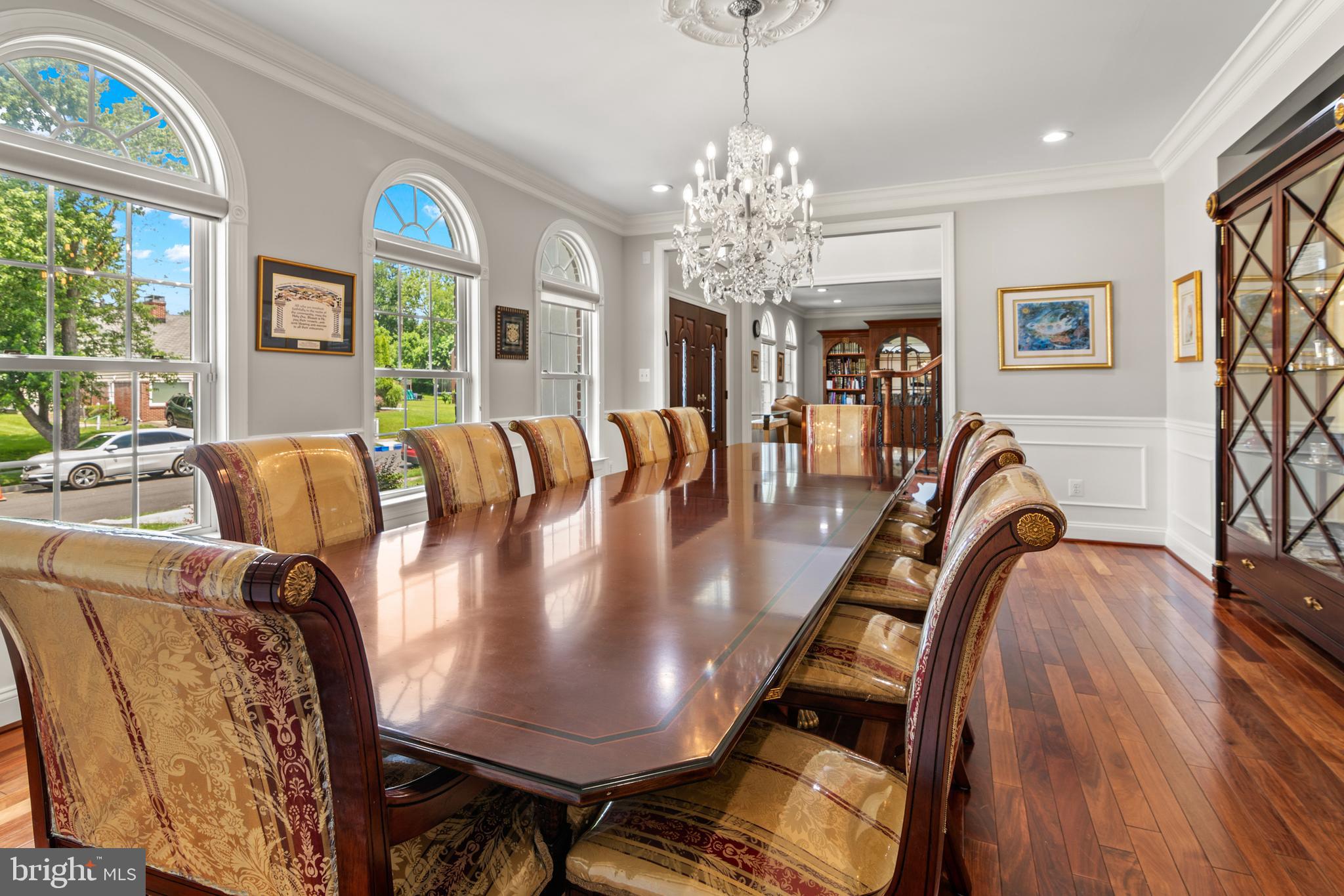3213 Hatton Road Baltimore, MD 21208 - Photo 7 of 69 a view of a dining room with furniture a chandelier and large windows