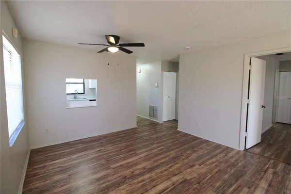 a view of an empty room with a window