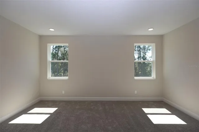 an empty room with windows