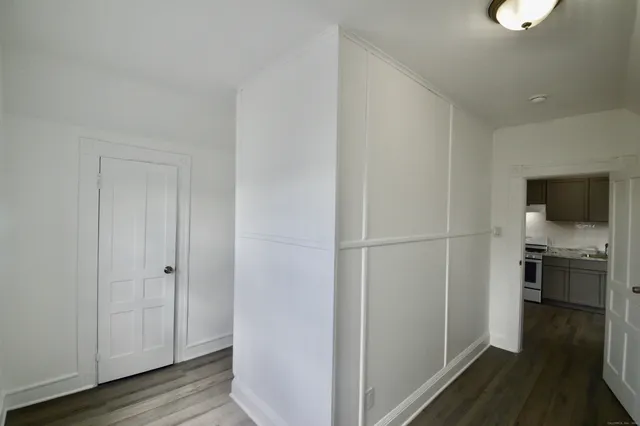 a view of a kitchen from the hallway