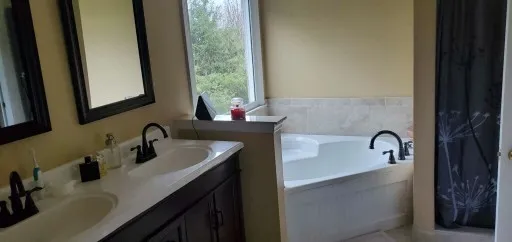 a bathroom with a sink and a mirror