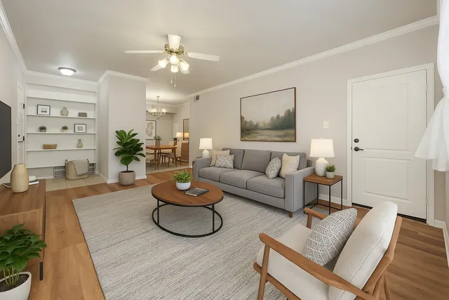 a living room with furniture and a chandelier